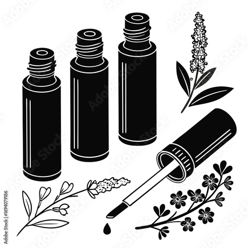 Essential oil bottles and botanical elements dropper