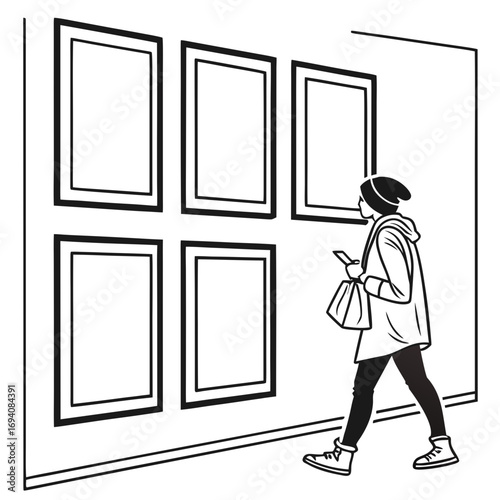 Person looking at wall art frames