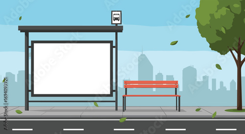 Urban transit stop with billboards and seating under autumn foliage falling gently