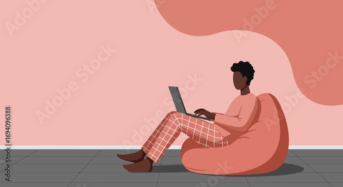 A person works remotely from home, comfortably using a laptop on a bean bag chair. Ideal for concepts of work-life balance, remote jobs, or relaxed productivity.