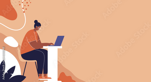 Focused person in glasses working remotely on a laptop at a modern desk. Represents productivity, online learning, or freelance work in a comfortable setting.