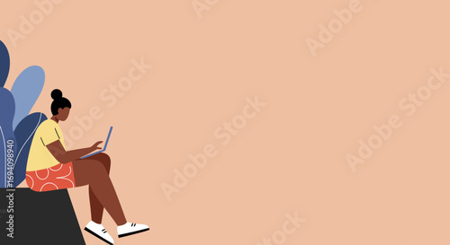 Relaxed young woman using a laptop for remote work or online learning, embodying a modern digital lifestyle or flexible productivity.