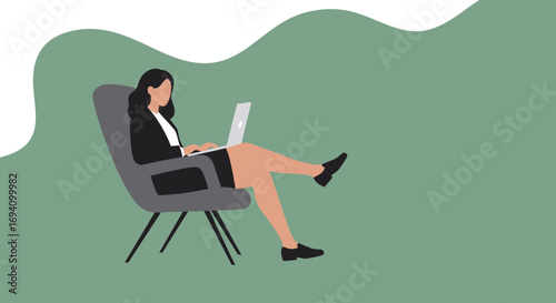 Focused businesswoman working efficiently on her laptop while relaxing in a modern chair, illustrating remote work and flexible lifestyle.