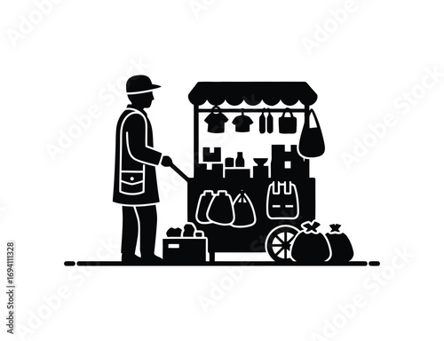 Silhouette of a street vendor selling clothes
