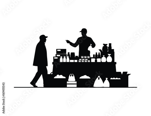 Silhouette of a vendor selling goods at an outdoor market