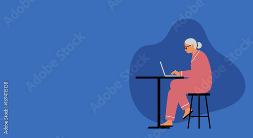 Elderly woman in pajamas comfortably working or learning on her laptop at home. Represents remote work, digital literacy, and modern senior lifestyle.