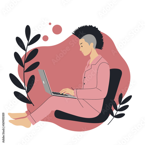 Relaxed person with a unique haircut working on a laptop at home in pajamas, symbolizing modern remote work and flexible lifestyle.