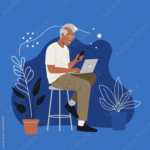 Elderly man focused on using a laptop and smartphone simultaneously, representing digital literacy, remote work, and modern connectivity for seniors.