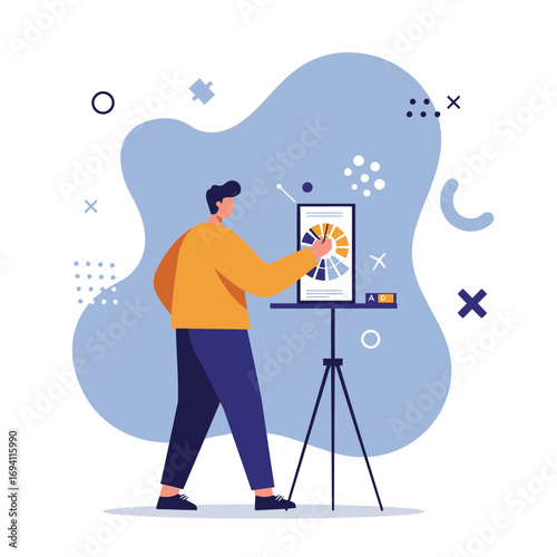 Young man working with a color wheel on a digital screen, showcasing design, creativity, and development process. Ideal for graphic arts and marketing.