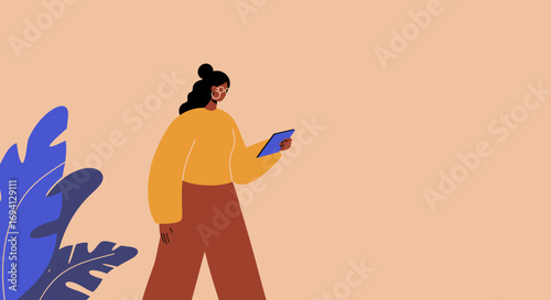 Stylish woman uses tablet, engaged in digital communication or work, with plants in a modern, casual setting. Ideal for technology, lifestyle, and business concepts.