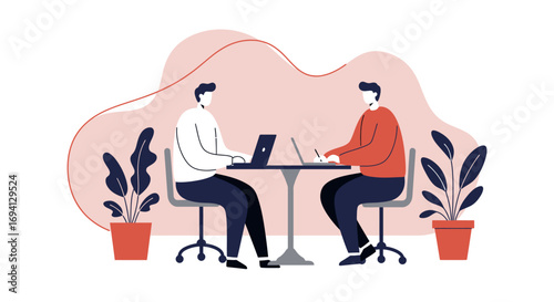 Two men collaborating on laptops and writing at a table in a modern office or co-working space, representing teamwork and productivity.
