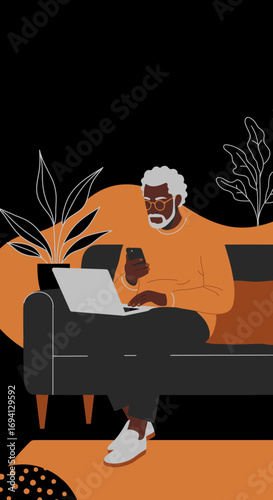 Senior Black man working remotely on a laptop and smartphone from home. Depicts modern lifestyle, digital connectivity, and productivity for older adults.