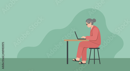 An elderly woman with glasses intently works on her laptop at a desk, showcasing senior digital literacy and remote productivity. Ideal for technology, business, or lifestyle themes.