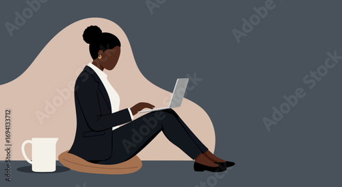 Focused businesswoman works remotely on a laptop from a comfortable setting, symbolizing modern work flexibility and productivity.