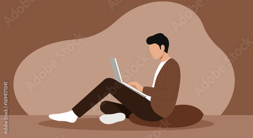 A focused man works remotely on his laptop, sitting comfortably indoors. Represents productivity, online learning, and modern digital lifestyle.