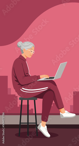 Active senior woman happily uses a laptop for online learning or staying connected, embodying modern digital literacy and an engaged lifestyle.