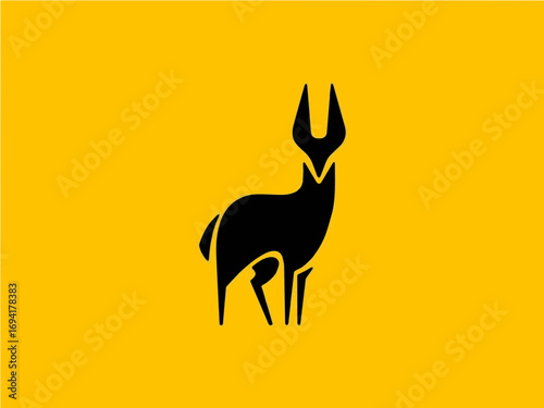 Elegant black antelope silhouette on vibrant yellow backdrop, representing nature and wildlife freedom