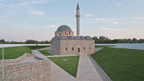 Exploring the architectural beauty of Xhamia e Plumbit in Shkodra, Albania at sunset