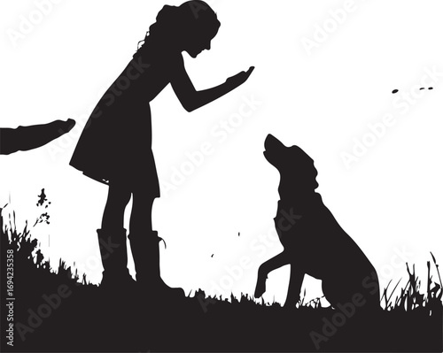 Silhouette of a girl training a dog outdoors playing