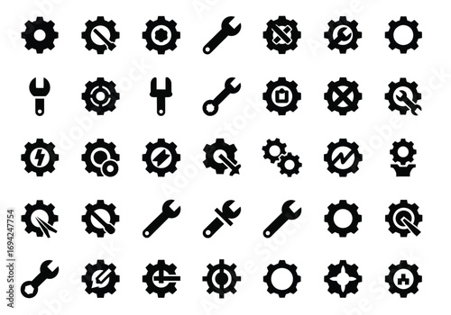 Collection of black gear and wrench icons, representing mechanical engineering, tools, and industry
