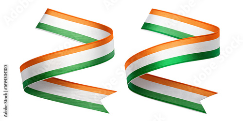 Two vibrant indian flag colored ribbons twisted and curled against a stark black background representing national pride
