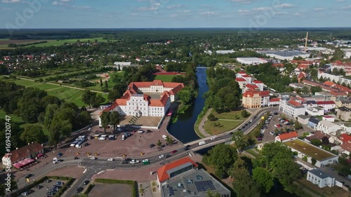 Aerial drone view of Oranienburg Palace (Schlossmuseum Oranienburg), historic baroque landmark and museum surrounded by gardens in Oranienburg, Brandenburg, Germany. 15 September 2024
