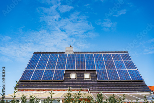 Wallpaper Mural Blue photovoltaic panels on residential roof Torontodigital.ca