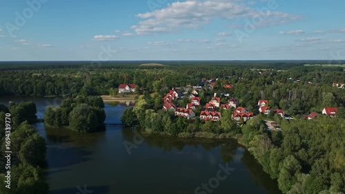 Aerial drone view of Germendorfer Waldsee lake in Germendorf, Oranienburg, Brandenburg, Germany, scenic natural water landscape surrounded by forest and countryside.