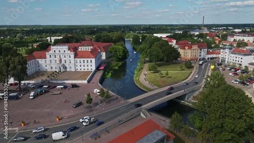 Aerial drone view of Oranienburg Palace (Schlossmuseum Oranienburg), historic baroque landmark and museum surrounded by gardens in Oranienburg, Brandenburg, Germany. 15 September 2024