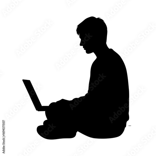Silhouette of a young person sitting and working on a laptop isolated on white background