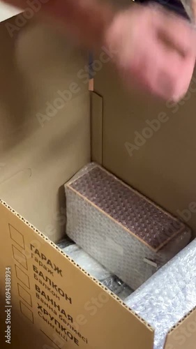 Wallpaper Mural Packing Goods Meticulously for a Special Charity Event in a Cozy Setting Torontodigital.ca