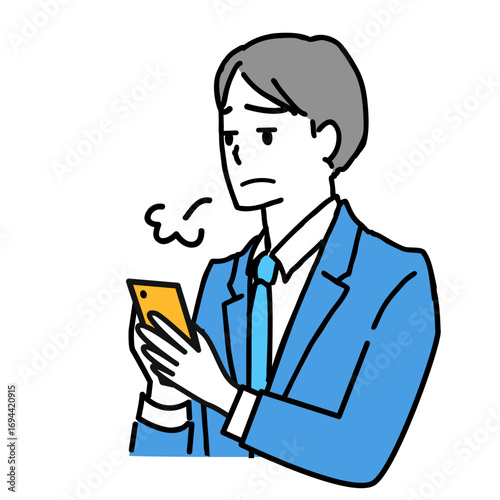 スマホを見てため息をつくスーツ姿の若い男性