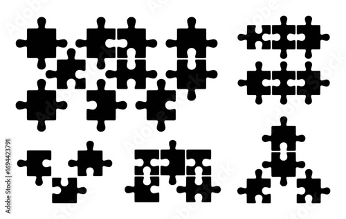 Black Puzzle Pieces Arranged in Various Configurations on White Background