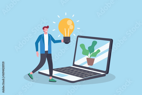 Man holding a glowing light bulb near a laptop with a plant on screen representing a new idea