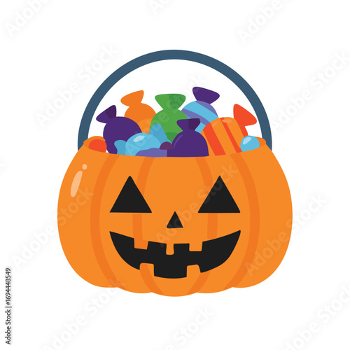 Orange pumpkin basket filled with colorful candies halloween jack o lantern
