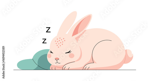 Adorable pink bunny rabbit fast asleep on a teal pillow with zzzs floating above its head