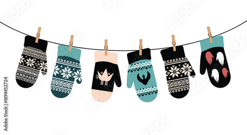 Winter wool mittens with festive patterns hanging on a clothesline for display