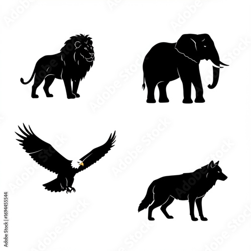 Silhouette of four animals: lion, elephant, eagle, and wolf in black. The image showcases the animals' distinctive silhouettes and unique characteristics