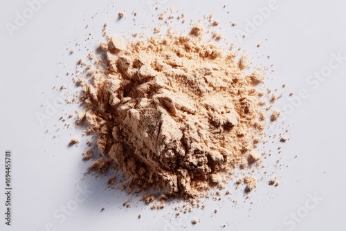Light beige powder pile on white background (2)