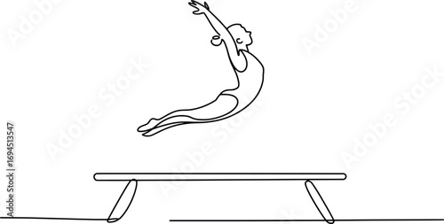 Artistic gymnast captures mid-air leap above balance beam artistic sports performance