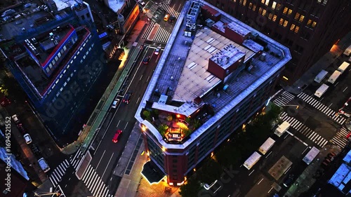 New York lights on a beautiful evening. Manhattan from rooftop. Aerial top view of the intersection of 6th Avenue and Church Street.