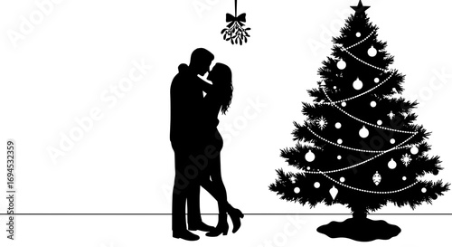 Couple kissing under mistletoe with Christmas tree in background  
