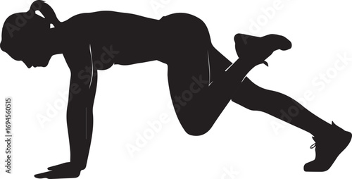 Silhouette of a fit woman performing a dynamic core strength exercise in a gym