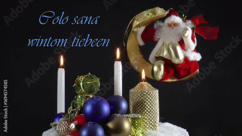 Warm Wishes for Christmas Joy 
A festive card with candles, baubles, and Santa Claus in the language Egyptian 
