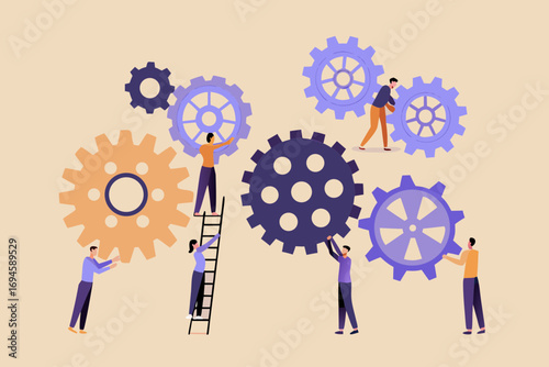 Diverse team of people working together to assemble and connect gears for a complex mechanism