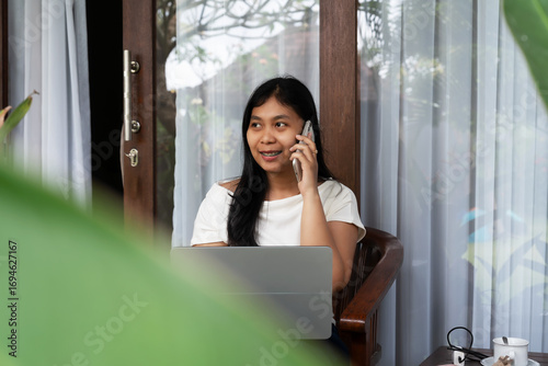 Woman talking on a smartphone Bali Indonesia Free Download Woman talking on a smartphone Bali Indonesia - GFXLoad