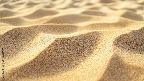 Fototapeta Naklejka Na Ścianę i Meble -  Sand dunes with sunlight patterns on a beach.