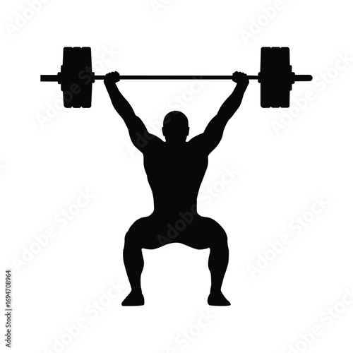 Silhouette of a weightlifter performing a clean and jerk lift