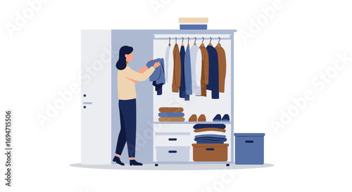 Woman organizing clothes in a minimalist wardrobe with neat shelves