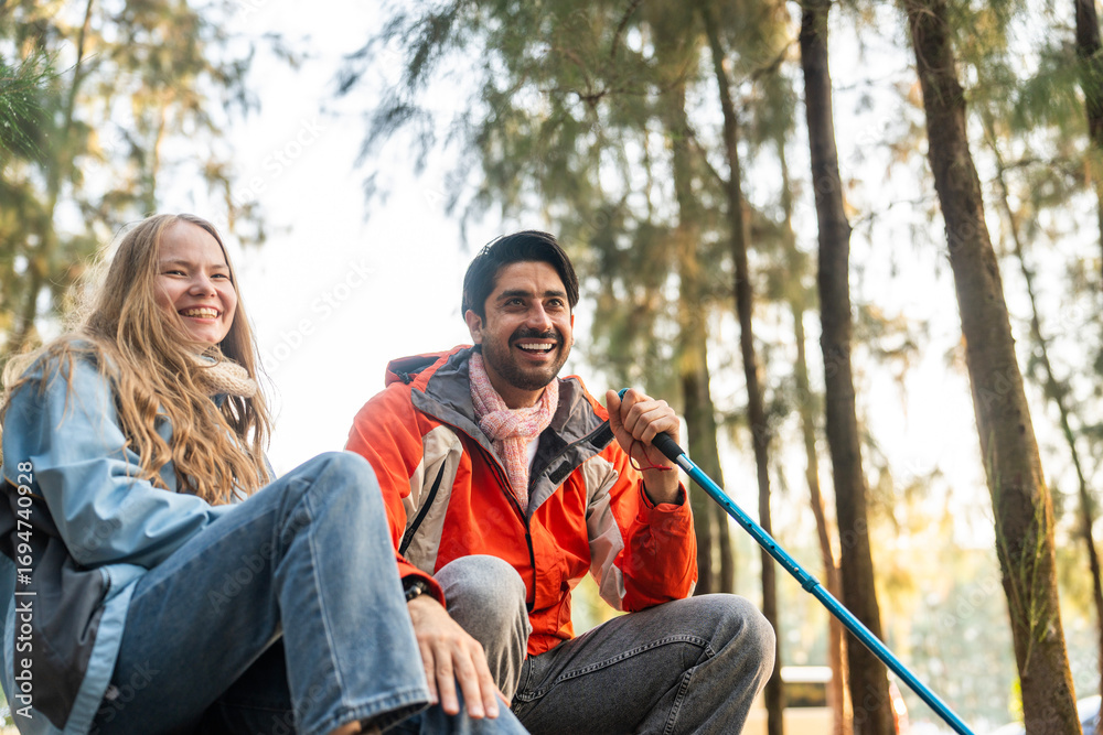 Happy Hiking Couple Giving High Five – Joyful Travelers Celebrate Outdoors Success in Forest Setting, Sitting on Camping Chairs Surrounded by Trees and Morning Light Happy Hiking Couple Giving High Five – Joyful Travelers Celebrate Outdoors Success in Forest Setting, Sitting on Camping Chairs Surrounded by Trees and Morning Light